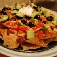 Ultimate Nachos · Tortilla chips with cheese, jalapenos, sour cream, salsa on the side.