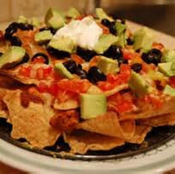 Ultimate Nachos · Tortilla chips with cheese, jalapenos, sour cream, salsa on the side.