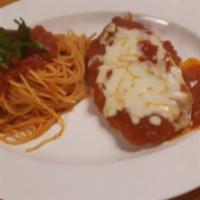 Chicken and Veal Parmigiana · Breaded chicken, or veal topped with marinara and mozzarella cheese on top.