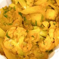 Aloo Gobi  · Cauliflower cooked with potatoes and spices 