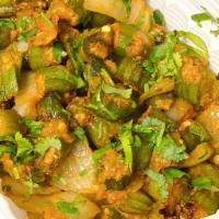 Bhindi Masala  · Fresh okra cooked with onions, tomatoes, ginger, and herbs 