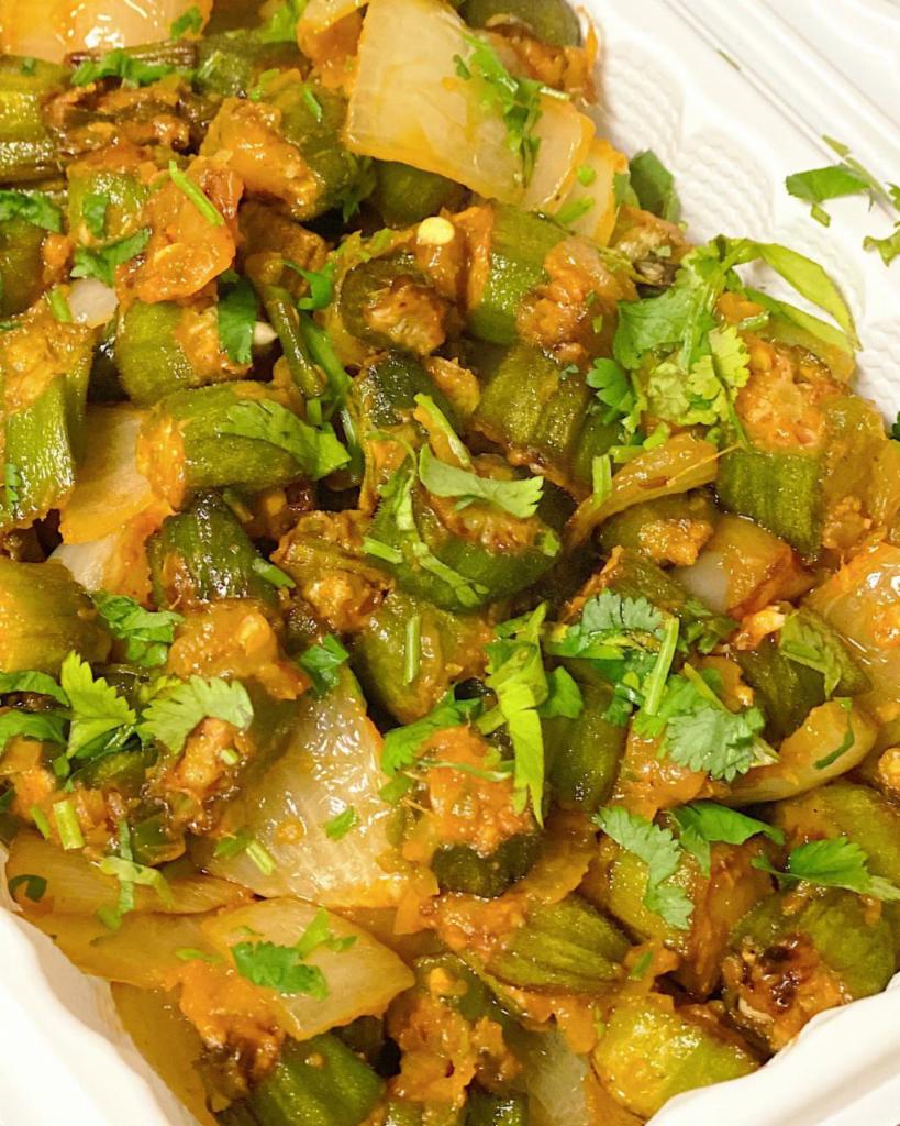 Bhindi Masala  · Fresh okra cooked with onions, tomatoes, ginger, and herbs 
