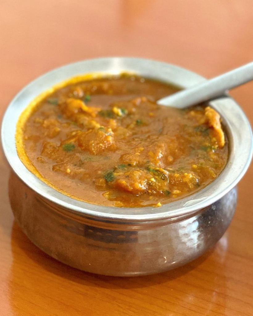 Chicken Curry  · Traditional boneless chicken curry cooked with our indian spices & herbs. 