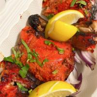 Tandoori Chicken Leg Half  · Chicken marinated with Indian spices & yogurt & roasted in clay oven (4 pieces). 