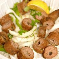 Lamb Seekh Kabab  · Ground lamb marinated in spices & roasted. 