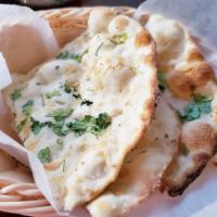 Garlic Naan  · Leavened Bread cooked with fresh garlic 
