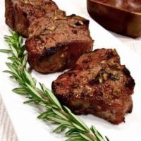 Lamb Chops with Side of Rice · Lamb chops marinated in spices and cooked in clay oven. 4 pieces.