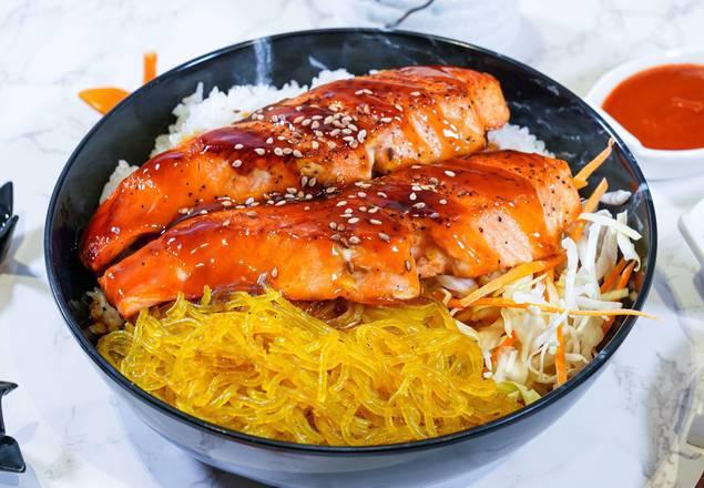 Salmon Bop · 6 oz of fresh farm-raised salmon grilled and seared with garlic butter, lemon, and sweet soy sauce served with steamed rice, potato noodle, and cabbage mix.
