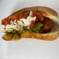 Cali-Mex Hot dog · Delicious grilled beef hot dog wrapped in bacon, Topped with diced jalapenos, salsa and dice...