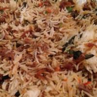 Lamb Biryani · Lamb cooked with spices and tomatoes, layered in basmati rice.