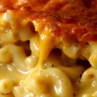 Baked Mac N Cheese · Baked pasta topped with blended cheeses & spices