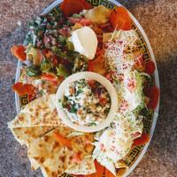 Sampler Platter · A tasty combination of our most popular items meant for sharing. Cheese quesadillas, nachos,...