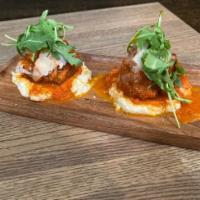 Meatball Polenta · braised beef and pork meatballs in a tomato sauce served over creamy polenta
