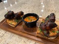 Bacon Dates · fresh dates bacon wrapped served with a  chipotle red pepper sauce