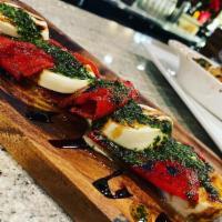 Red Pepper Caprese · fire roasted sweet peppers, fresh mozzarella, basil pesto, balsamic reduction