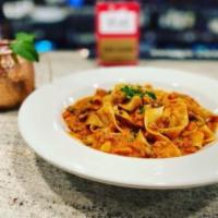 Tagatelli · tagliatelle in a beef ragu, carrot, celery and parmigiana reggiano