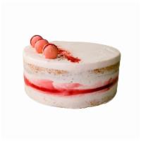 GF ALMOND BERRY WHOLE CAKE · Almond pound cake filled with jam & berry buttercream, decorated with French macarons and be...