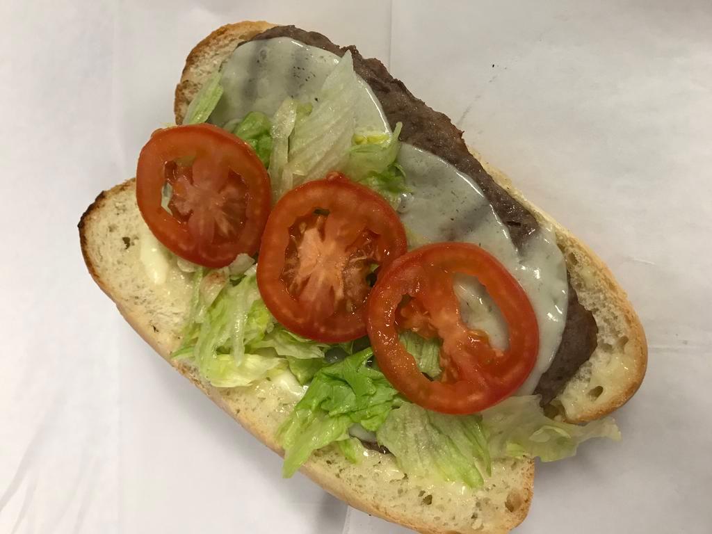 Steak Sub · Rib eye steak meat sliced ultra thin on a sub roll with lettuce, tomato, mayo, cooked onions and hots. (Please specify down below under special instructions if you do NOT want everything on your sub)