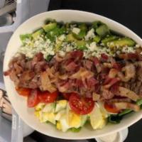 Cobb Salad · Hard boiled egg, chicken, avocados, tomato, bacon and blue cheese, romaine and ranch dressing.