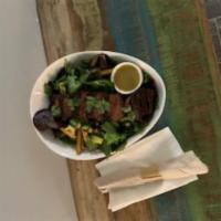 Philly Steak Salad · Mixed greens, steak, french fries and avocado served with vinaigrette.