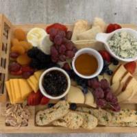 Cheese Plate · Blue cheese, smoked gouda, aged cheddar and brie served with candied walnuts, dried apricots...