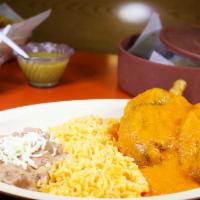 2 Chilles Rellenos · Two poblano peppers stuffed with cheese and served with rice and beans.