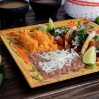Tacos Dinner  · 3 tacos served with rice, beans, and a choice of steak, chicken, pastor, chorizo, ground bee...