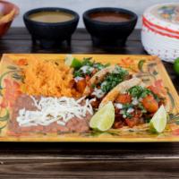 Tacos Dinner  · 3 tacos served with rice, beans and a choice of carnitas (fried pork meat), camaron (breaded...