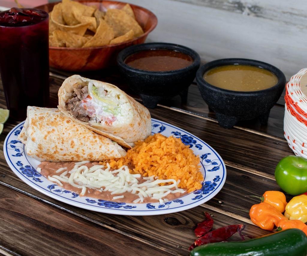 Burrito Dinner · Choice of steak, chicken, spiced pork, ground beef, fried pork or Mexican sausage.