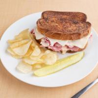 9. Reuben · Served hot. Corned beef, Swiss cheese, sauerkraut and Thousand Island dressing toasted on ma...