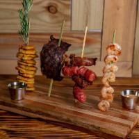Las Cortinas Del Palacio · Grilled Sampler for 2 of skirt steak, chicken breast, shrimps, chorizo, sausage and fried pl...