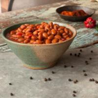 Bojangles' Cajun Pintos · Slow-cooked pinto beans with a flavorful blend of Cajun spices.