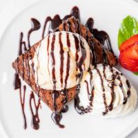 Chocolate Brownie · Brownie, vanilla ice cream, and chocolate syrup on top.