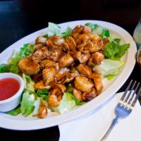 High Protein House Special Salad · Chicken tips, shrimp, feta cheese and bacon stir-fry in a teriyaki marinade served over a Ca...
