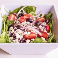Spinach Salad · Fresh baby spinach, tomatoes, red onions, Kalamata olives, Gorgonzola cheese and balsamic vi...