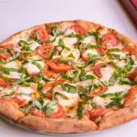Margherita Pizza · Fresh mozzarella, basil and tomatoes, drizzled with olive oil. 