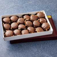 18 pc. Turtle · Made with pecan pieces, caramel and chocolate. Comes with choice of milk or dark chocolate.