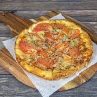 Margherita Pizza · Fresh tomato, basil and oregano.