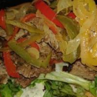 Steak Wrap / Sandwich  · Sliced Steak with roasted bell peppers, roasted onions, shredded lettuce, tomato and your ch...