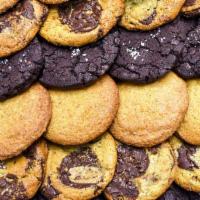 BAKED GOODS (ASSORTED DOZEN) · An assortment of our handmade baked goods, which includes chocolate chunk cookies with sea s...