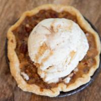 MINI PECAN PIE · Ooey, gooey pie made with toasted pecans and brown sugar nestled in a flakey, buttery pie cr...