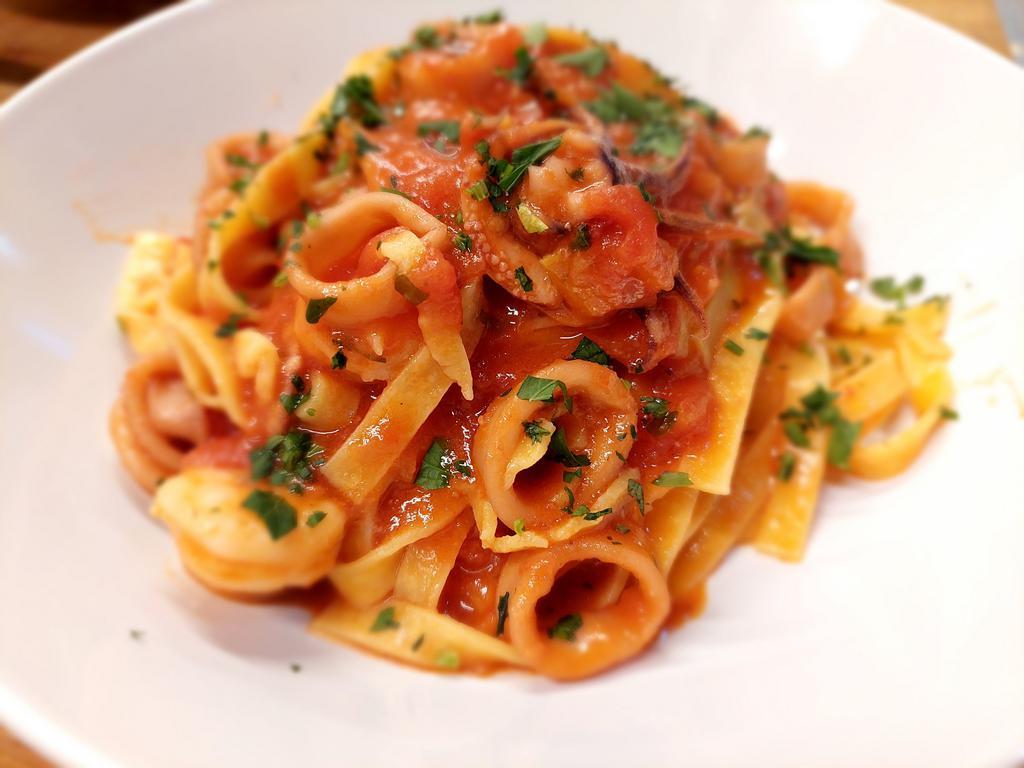 Fettuccine seafood  Mare · Calamari and shrimp, garlic, extra virgin olive oil, white wine, San Marzano tomato sauce, parsley, and pepperoncino.