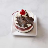 Black Forest Slice · Chocolate chiffon cake, cherry filling and whipped cream and crowned with maraschino cherries.
