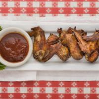 Smoked Whole Wings · 5 mouth watering jumbo wings pit smoked, served with sauce on the side.