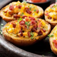 Potato Skins · 6 potato halves topped with melted cheddar and real bacon bits.