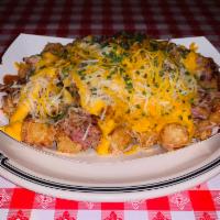 BBQ Tachos  · BBQ TACHOS Perfectly fried tater tot with your choice of our signature pulled pork or choppe...
