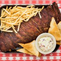 BBQ Pork Ribs · Our signature item. These ribs don't fall off the bone and it's on purpose! Hardwood barbecu...
