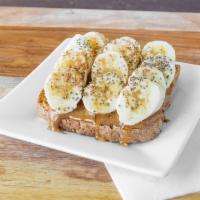 Almond Banana Toast · Sprouted organic bread, organic almond butter, banana, organic chia seeds, organic cinnamon ...