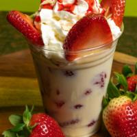 Strawberries, Bananas & Cream · Sweet cream decked with fresh strawberries, bananas, sliced almonds, whipped cream, and tast...