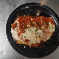 Chicken Parmigiana Plate · Fresh breaded chicken topped with our homemade tomato sauce, mozzarella cheese & fresh parsl...
